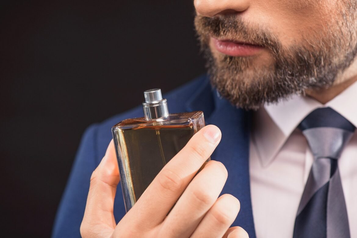 Man applying cologne properly